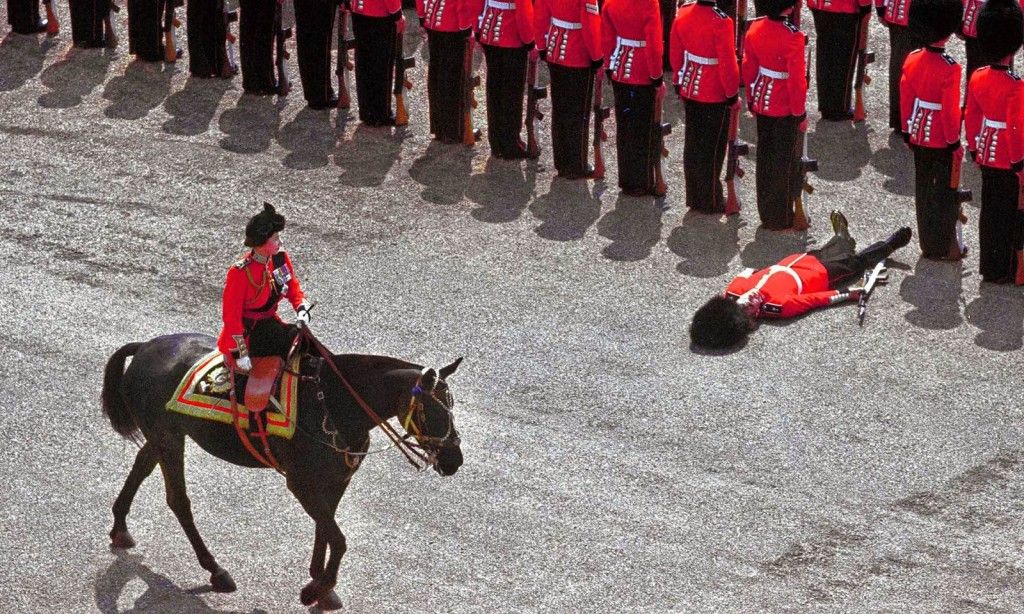 sygA guard of honor passes out as Queen Elizabeth II rides past during the trooping the color parade, 1970